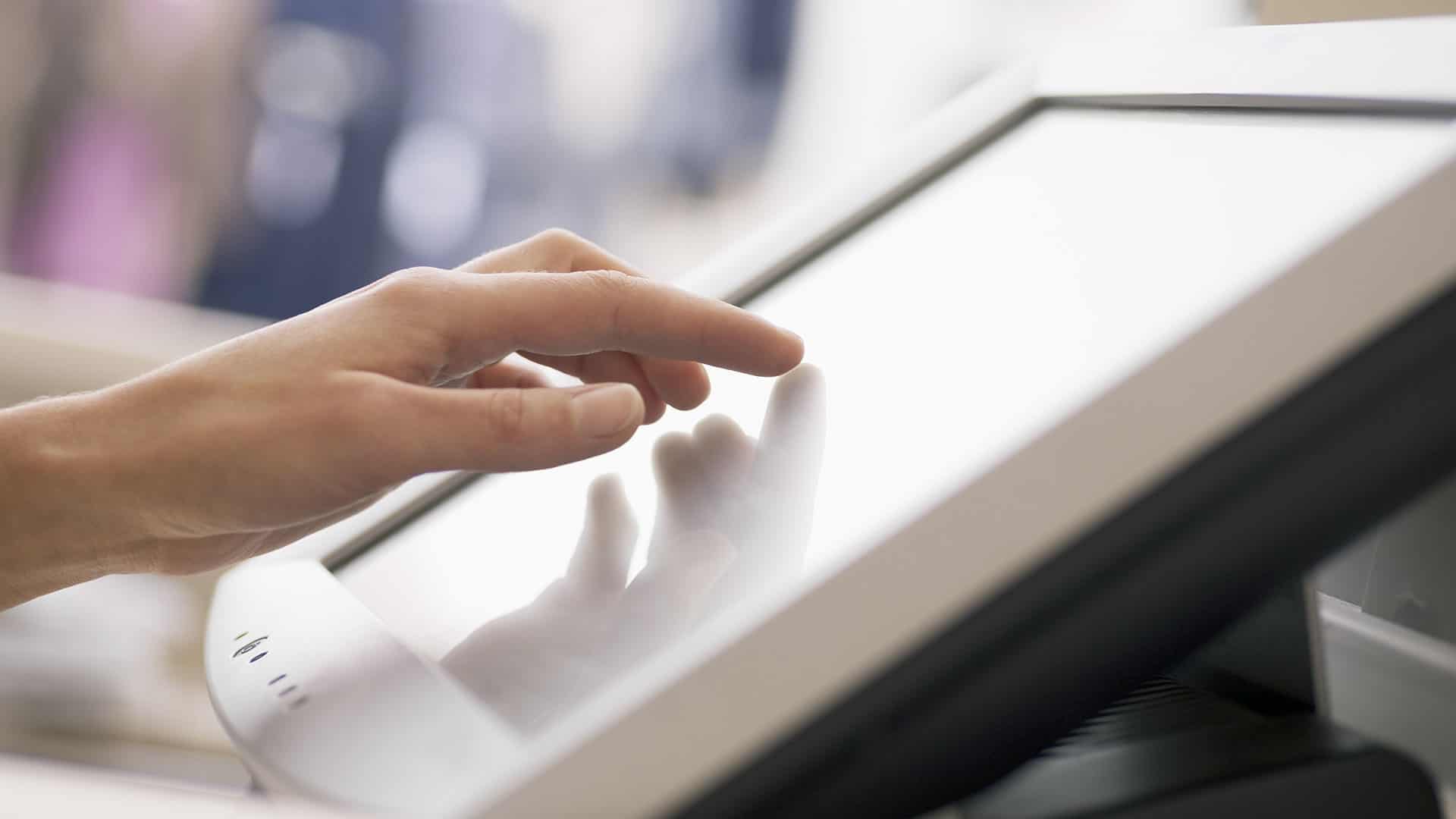 hand touching touch screen