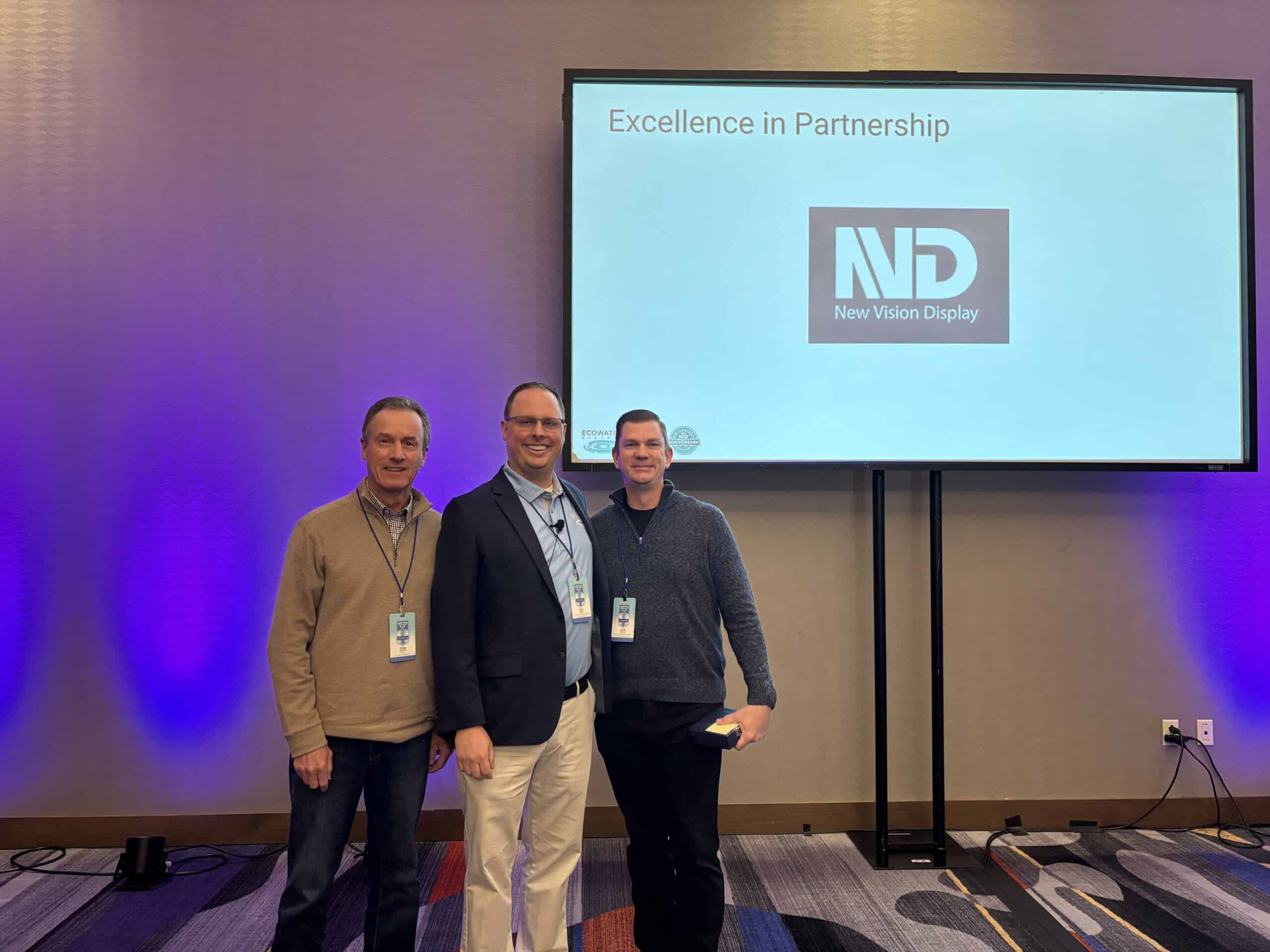Josh Toland receives the Ecowater Systems Excellence in Partnership Award on behalf of New Vision Display at the 2025 Supplier Summit